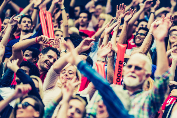 istock Crowds cheering on a sports stadium 1128896718