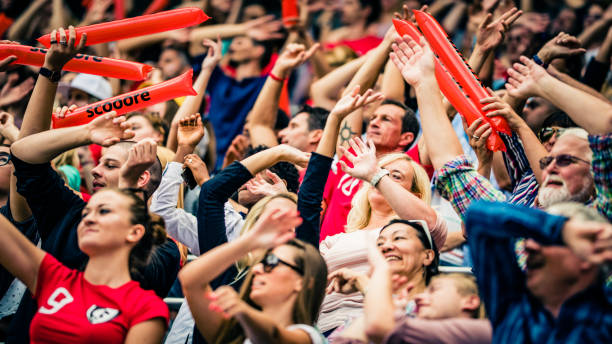 istock Crowds cheering on a sports stadium 1128896719