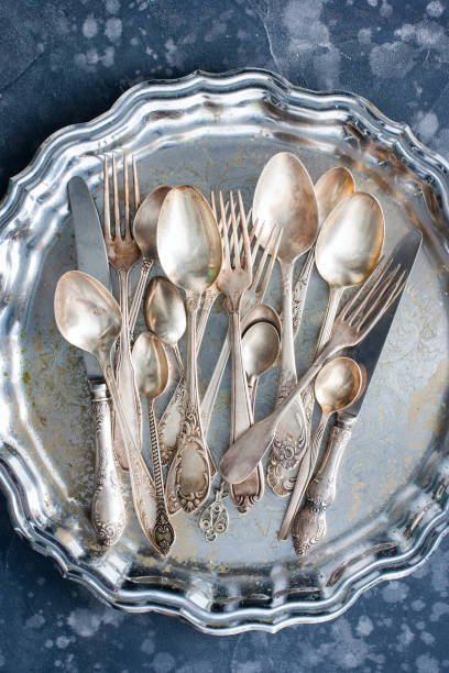 istock Melchior vintage dining items (tray, kettle, forks, knives, spoons, top view 1128897500
