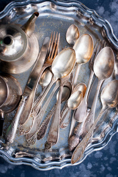 istock Melchior vintage dining items (tray, kettle, forks, knives, spoons, top view 1128897503