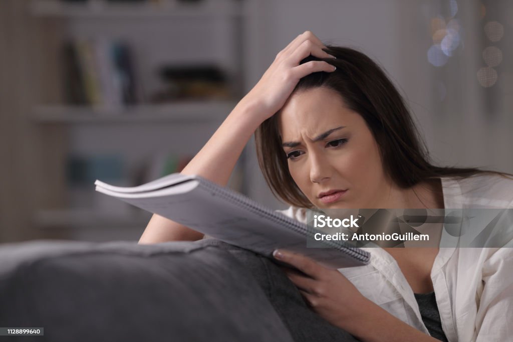 Worried student trying to understand difficult lesson Adolescence Stock Photo