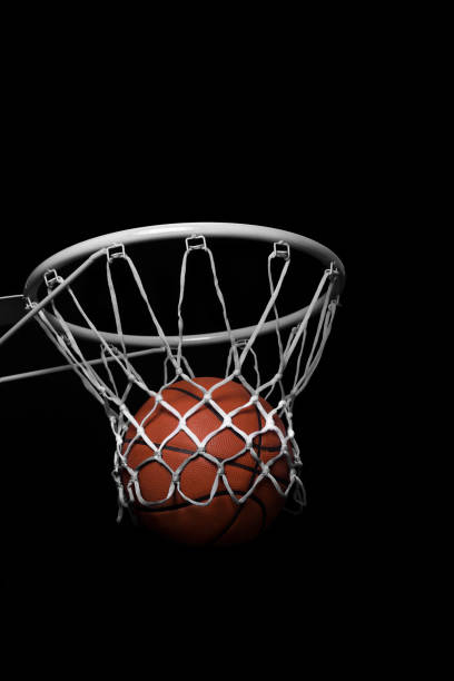 istock Ball inside a Basketball Hoop 1128900746