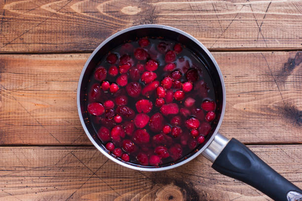 istock Step by step preparation of cranberry juice, step 3 - cooking juice, top view, selective focus 1128901316