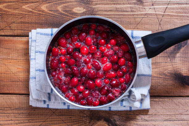 istock Step by step preparation of cranberry juice, step 3 - cooking juice, top view, selective focus 1128901321