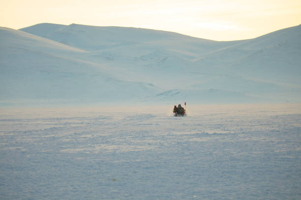 istock Horses pulling sleigh in winter - Cildir Lake, Kars 1128901637