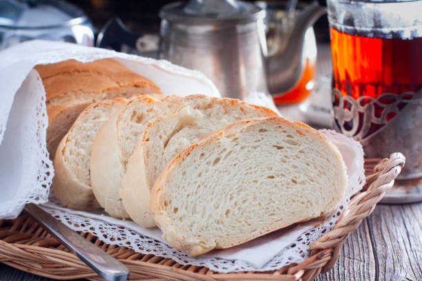 istock Homemade white bread in a rustic style, sliced, horizontal 1128902334