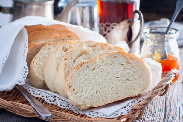 istock Homemade white bread in a rustic style, sliced, horizontal 1128902337