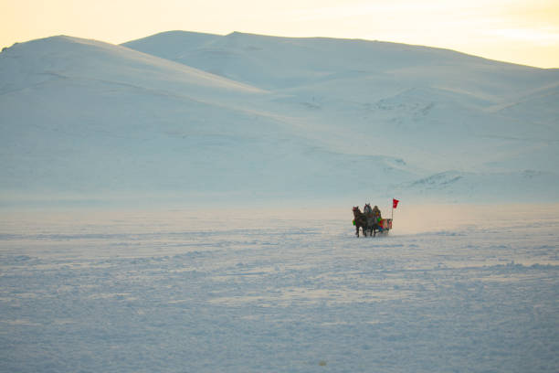 istock Horses pulling sleigh in winter - Cildir Lake, Kars 1128902503
