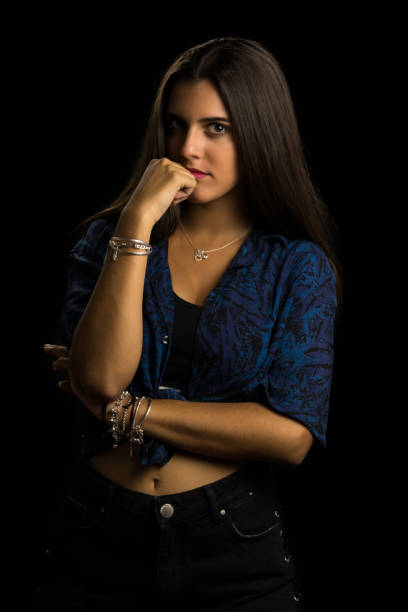 istock girl with long hair posing 1128905907