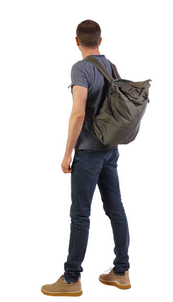 istock Back view of a man with a green bag. 1128906971