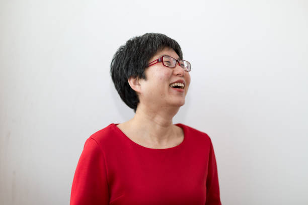 istock Positive middle-aged woman with sunshine 1128907298