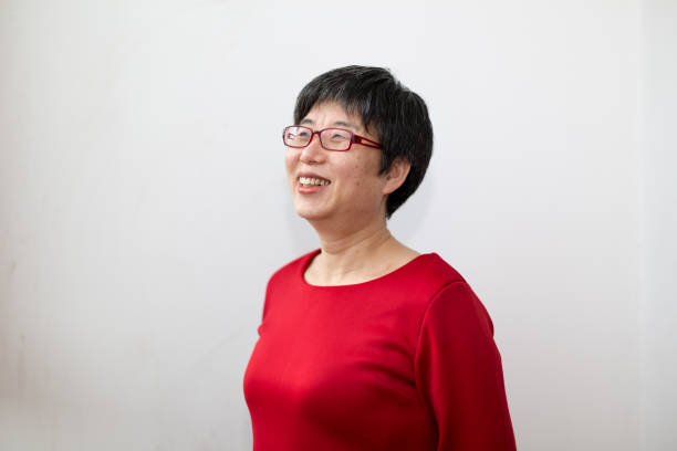 istock Positive middle-aged woman with sunshine 1128907327