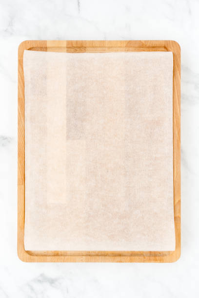 istock Wooden Chopping Board with White Parchment as Food Background 1128908034