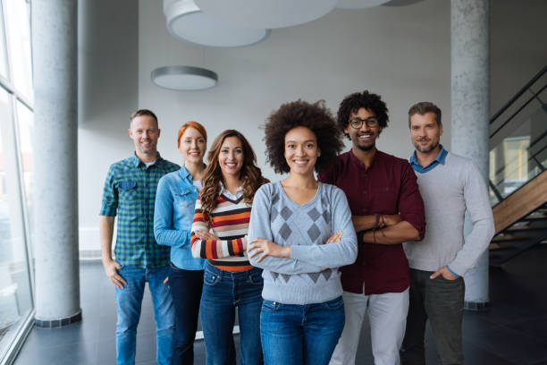 istock Organized group photo of successful business people at work 1128908084