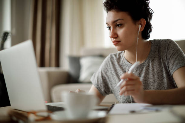 istock Young woman working at home 1128908945