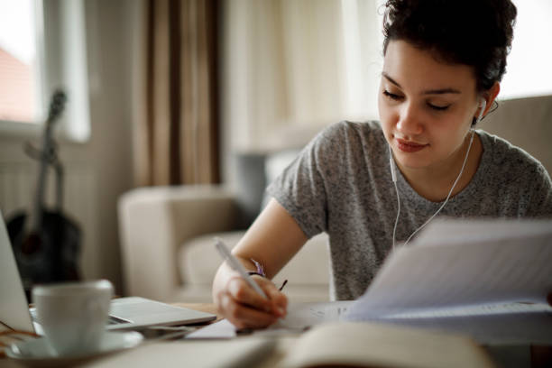 istock Young woman working at home 1128909000