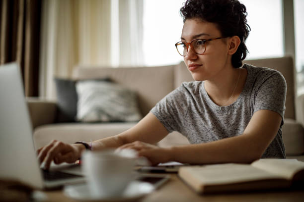 istock Young woman working at home 1128909037