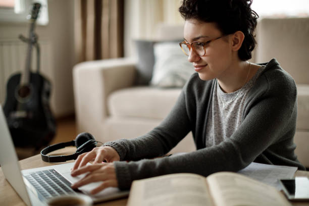 istock Young woman working at home 1128909058
