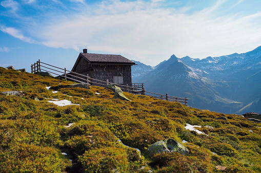 cozy mountain hut Gruenseehuette at Hohe Tauern national park, East Tyrol, Austria, as seen from public hiking trail