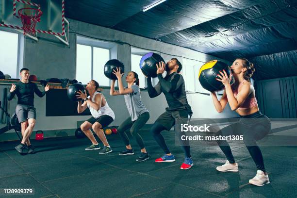 Functional Fitness Workout At The Gym With Medicine Ball Stock Photo - Download Image Now
