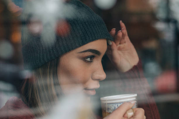 istock Pretty woman drinking tea 1128910271