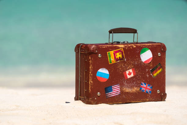 istock Travel  vintage suitcase is alone on a beach 1128910361