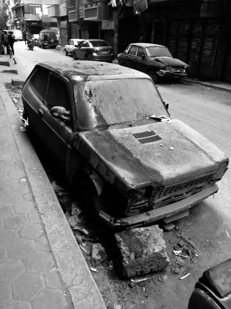 istock LIFE IN EGYPT - A VERY OLD CAR COVERED IN DUST 1128910443