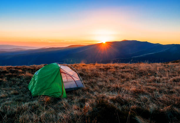 istock tourist tent on sunset 1128910975