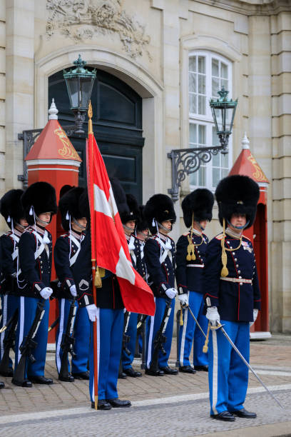 Copenhagen, Denmark - March 29, 2017: royal guards at Amalienborg Palace, the prime residence of the Danish royal family. The Amalienborg Palace consists of four palaces which are placed around Amalienborg square