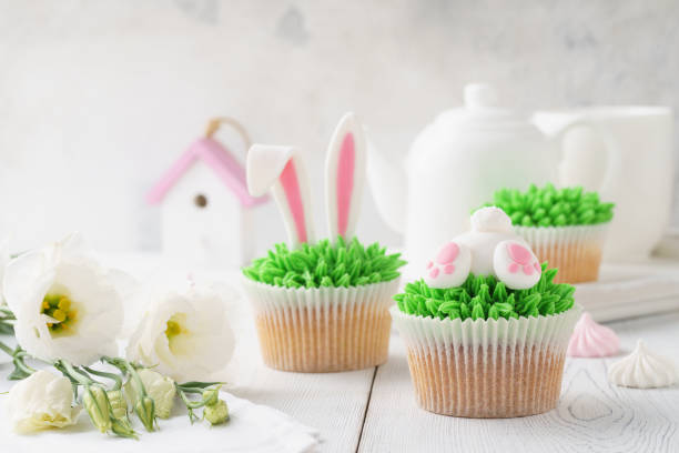 istock Set of Easter cupcakes for kids. Funny bunny butt and ears. 1128911034