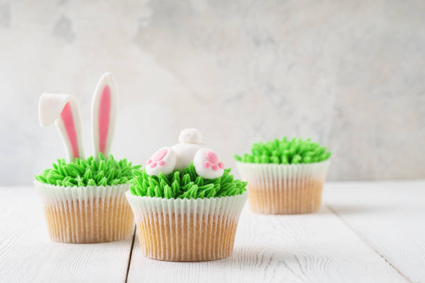 istock Easter cupcakes decorated with bunny butt and ears for dessert. 1128911229