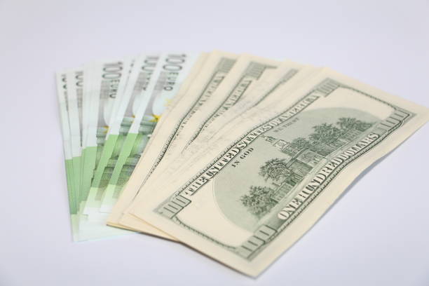 Dollars and euros on a white background. Cash to open your business.