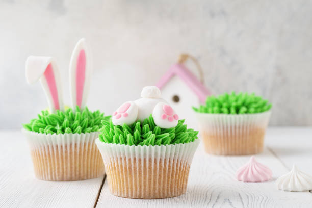 istock Easter cupcakes decorated with bunny butt and ears for dessert. 1128912110