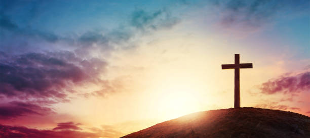 cross Silhouette cross on Calvary mountain sunset background. Easter concept cross stock pictures, royalty-free photos & images
