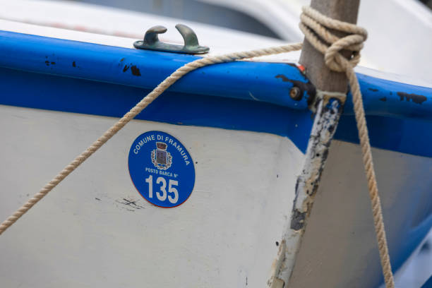 Framura, Italy - May 10, 2018; small fihing boat in the harbour of Framura, a small town on the Riviera di Levante in Liguria