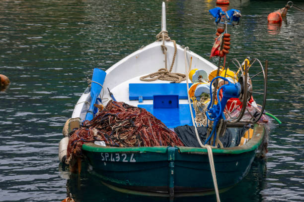 Framura, Italy - May 10, 2018; small fihing boat in the harbour of Framura, a small town on the Riviera di Levante in Liguria