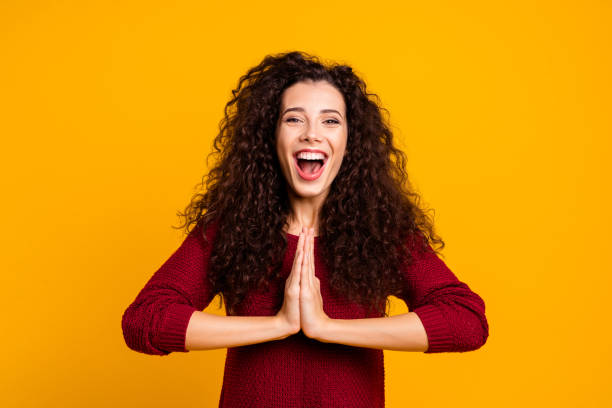 istock Close up photo beautiful cheerful amazing her she lady showing devotion issue glad attend yoga training friendly smile wearing red knitted sweater pullover clothes outfit isolated yellow background 1128917356