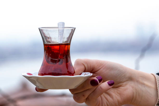 istock Hand holds a Cup of Turkish tea 1128917734