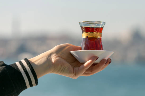 istock Hand holds a Cup of Turkish tea 1128917796