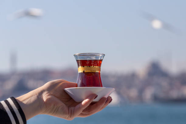 istock Hand holds a Cup of Turkish tea 1128917800