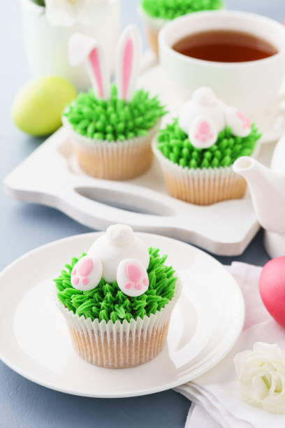 istock Easter cupcakes decorated for kids and tea for dessert 1128918396
