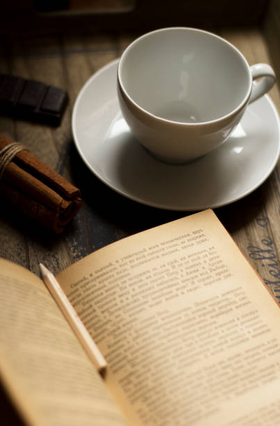 istock Cocoa drink, book,  cinnamon, chocolate and cookies 1128920579