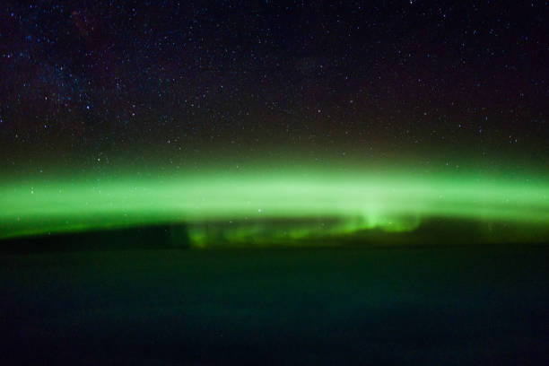 Aurora Borealis Northern lights captured out of the cockpit being inflight. weltall stock pictures, royalty-free photos & images