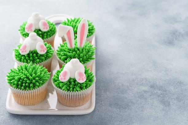 istock Set of Easter cupcakes for kids. Grass, bunny ears and butt. 1128922091