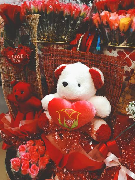 istock Valentine day with bear doll  and red roses 1128922212