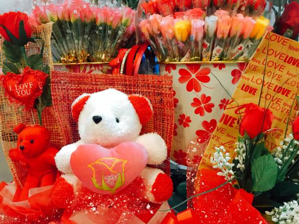 istock Valentine day with bear doll  and red roses 1128922286