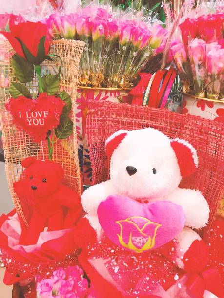 istock Valentine day with bear doll  and red roses 1128922346