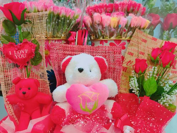 istock Valentine day with bear doll  and red roses 1128922358