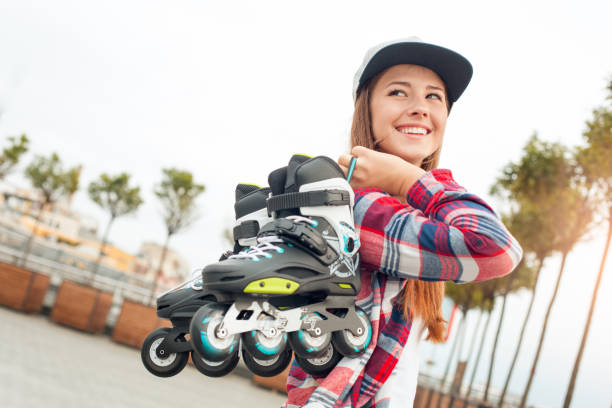 istock Young woman with roller skates outdoors active lifestyle 1128923393