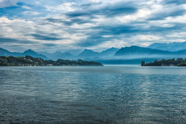 istock Gloomy Mountain Lake In Switzerland 1128923578